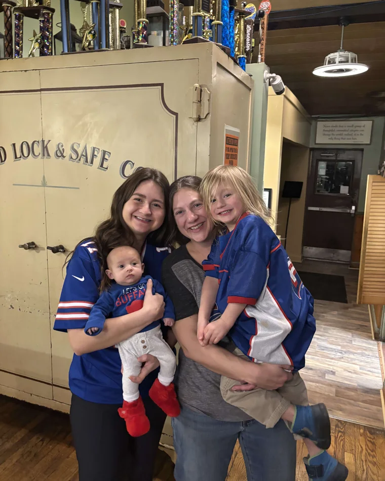 Frogtown regulars in Buffalo Bills gear, ready for football season, inside the cafe
