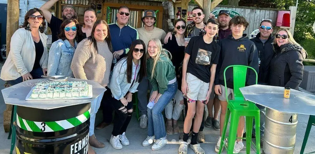 A big group gathered on Frogtown's patio around the barrel tables